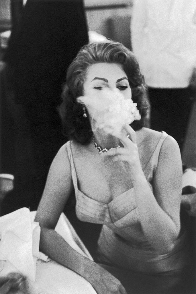 Sophia Loren smoking in a studio, 1950s.