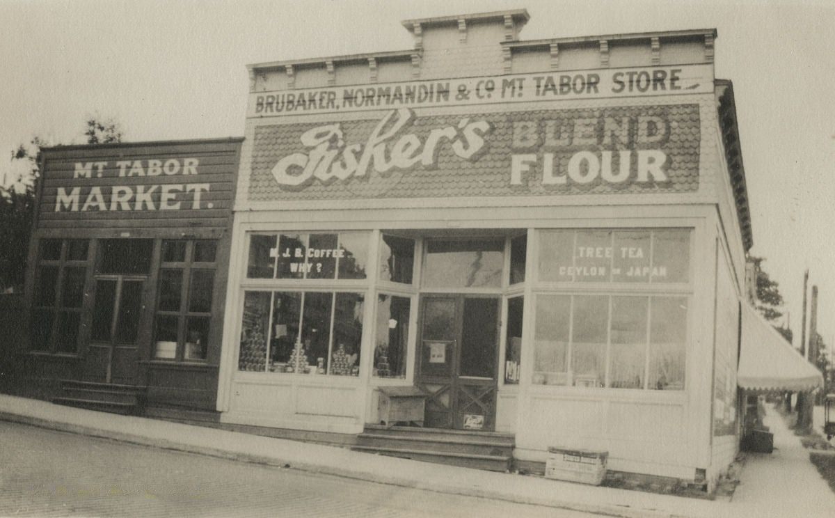 The Brubaker, Normandin, and Co. Mt. Tabor Store and the Mt. Tabor Market on the corner of SE Stark Street (Base Line Road) and SE 60th Avenue, circa 1900.