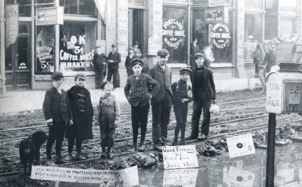 Children (near political signs) in front of the Portland and OK coffee houses, circa 1900