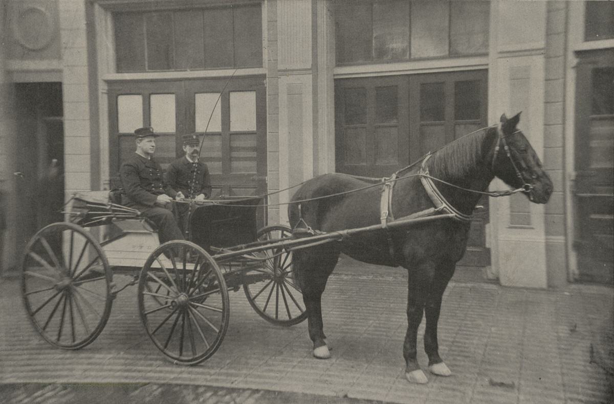Fire Chief David Campbell and George Walker in the Chief’s buggy outside Station 1, 1905.