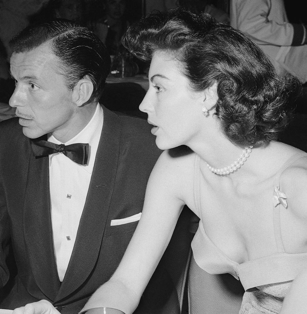 Frank Sinatra and Ave Gardner Sitting at Table, 1951.