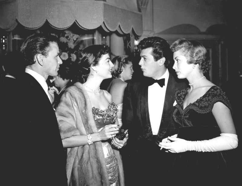 Frank Sinatra and Ava Gardner with Tony Curtis and Janet Leigh attend a dinner at the Empress Club, London, 1951.