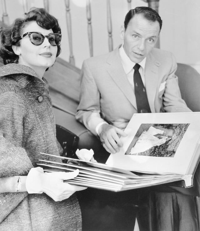 Sinatra helping Ava to choose a dress at Roman fashion salon, 1953.