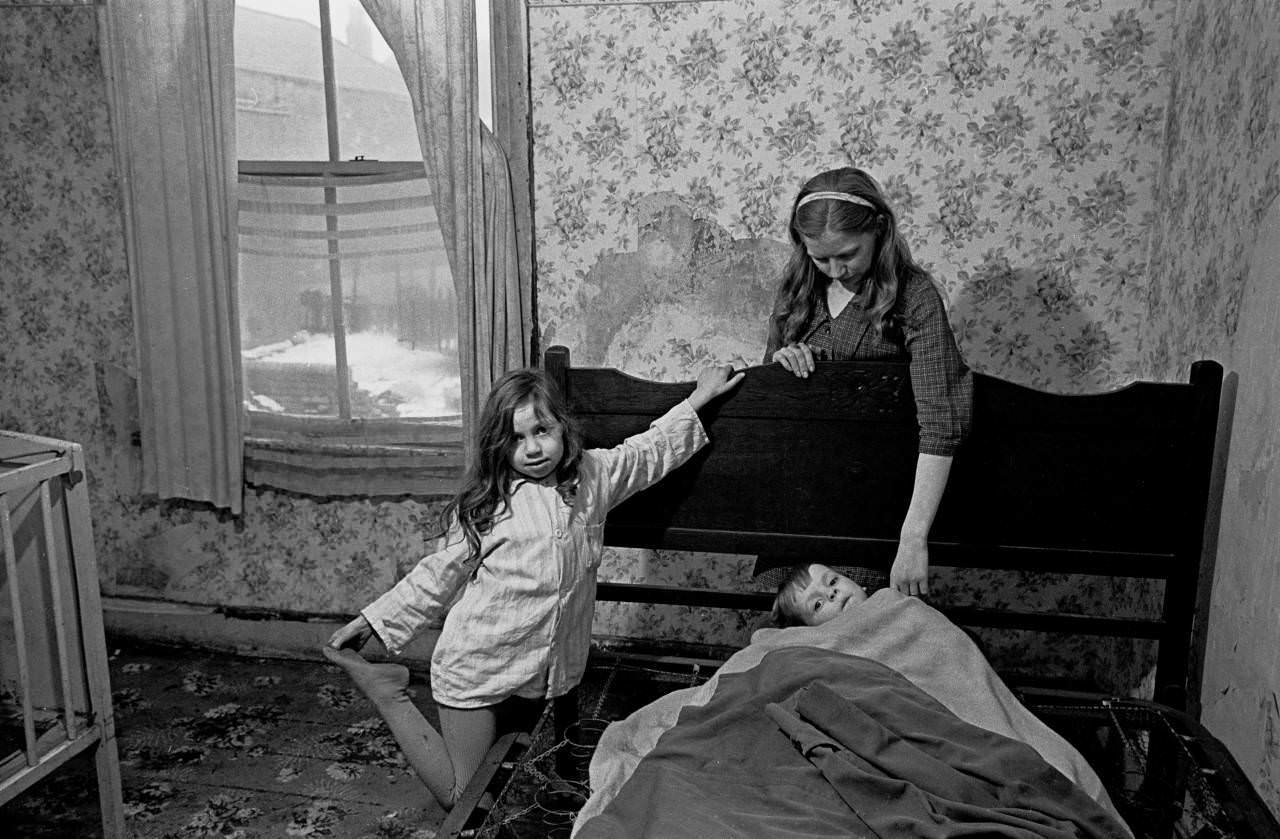 Mrs Milne puts her children to bed in the winter, Balsall Heath 1968