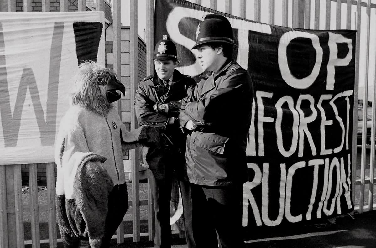 Policemen having a good time with a protestor.