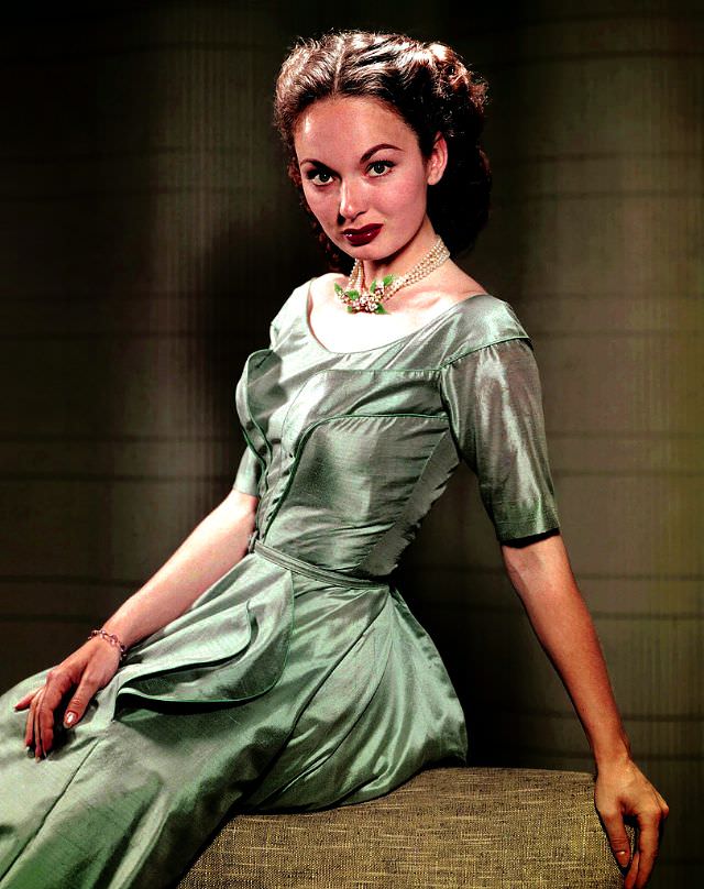 Ann Blyth models a ravishing taffeta dress of seafoam green