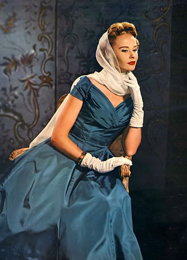 Model wearing a peacock blue dress of Arnel taffeta