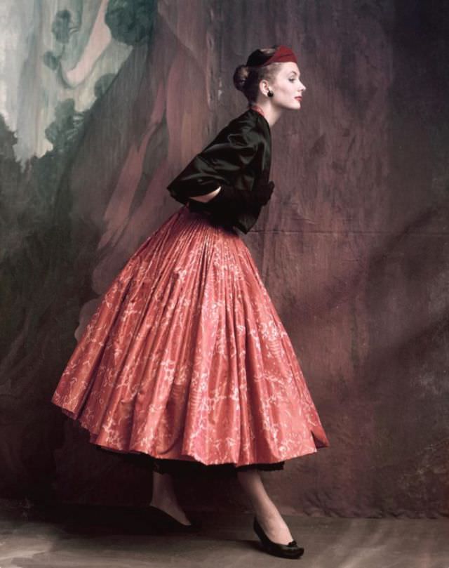 Suzy Parker is wearing Givenchy's Chinese printed taffeta skirt with a lace petticoat and a quilted satin blouse