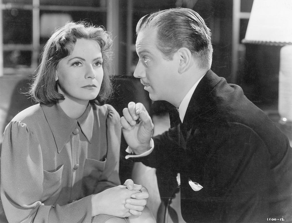 Greta Garbo listening to her co-star in the 1939 Metro-Goldwyn-Mayer production of "Ninotchka".