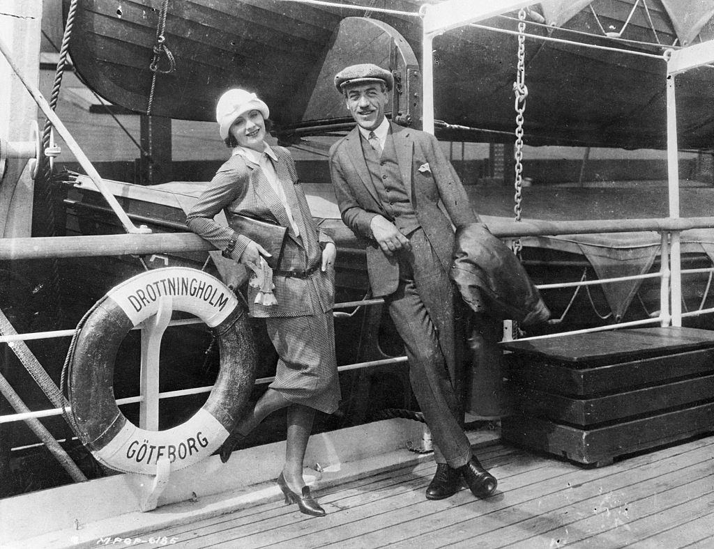 Greta Garbo with her director friend Mauritz Stiller as they arrive in the United States, 1925.