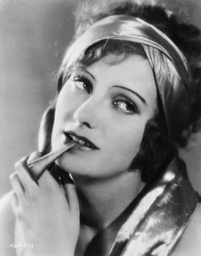 Greta Garbo wearing a satin bandeau, 1927.