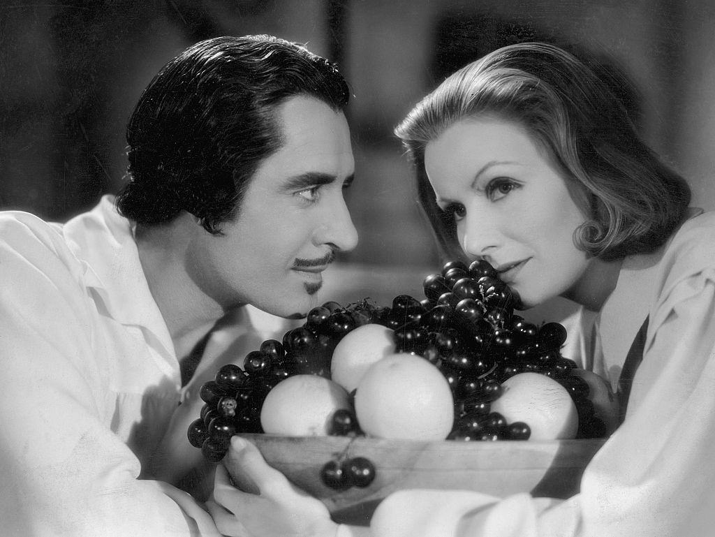 Greta Garbo with John Gilbert in a scene from 'Queen Christina', 1933