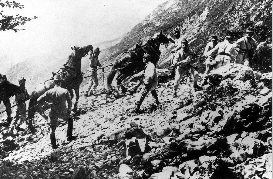 Austrian mountain infantry haul ordnance up a slope. 1916.