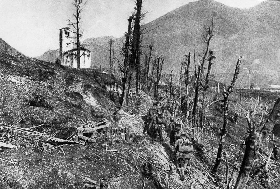 German soldiers pass through destroyed Italian positions near St. Daniel during the 12th Battle of the Isonzo. 1917.