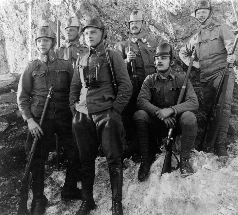 Austro-Hungarian soldiers wear new steel helmets.
