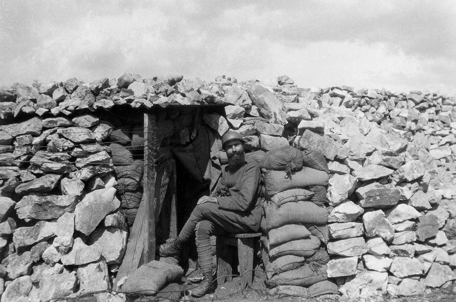 An Italian soldier outside a mountain bunker. 1916.