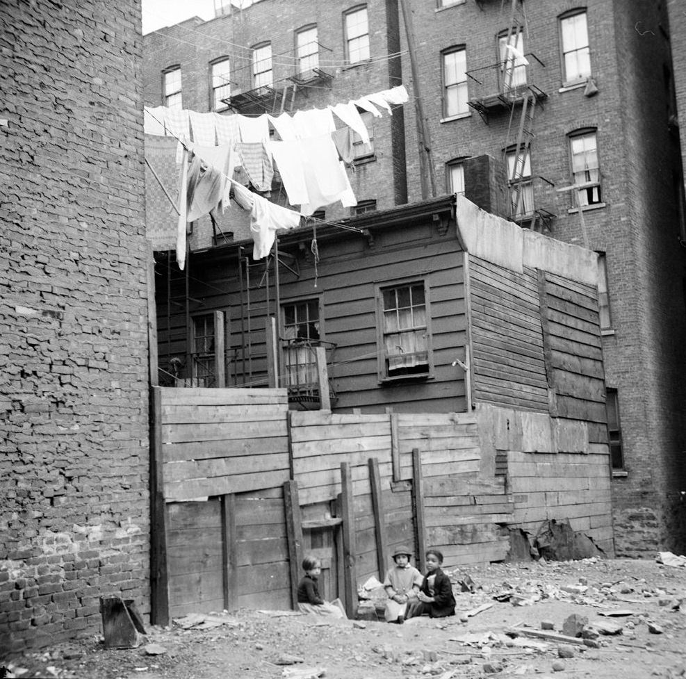 Wooden Rear Tenements–Children Playing in Dirt. 1935. (Museum of the City of New York)