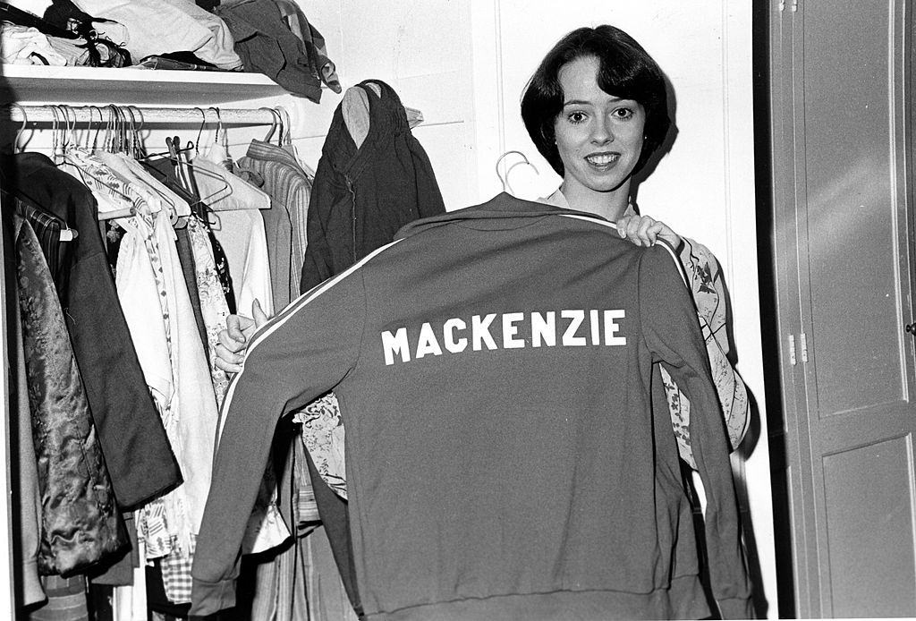 Mackenzie Phillips holding a jacket with her name on it, 1976.