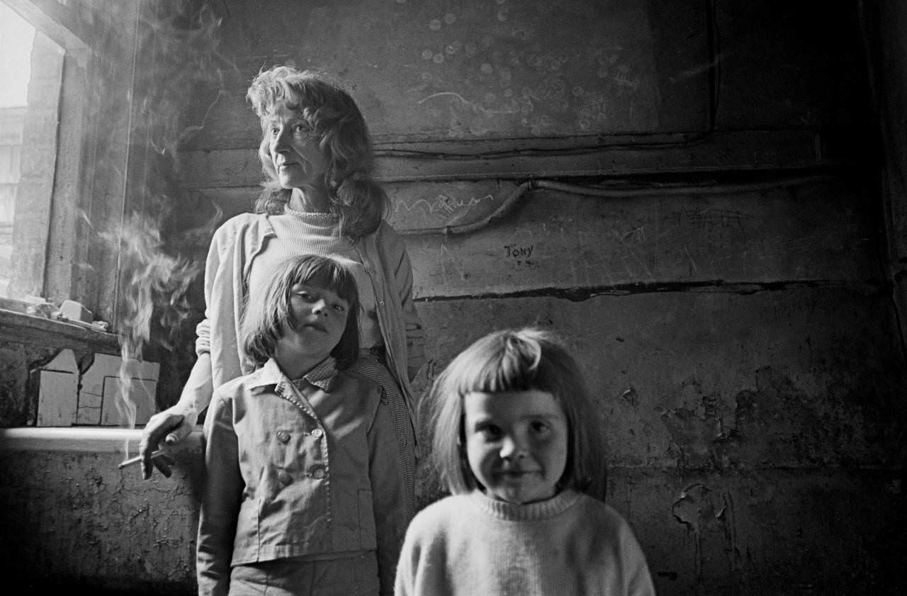 Mother and her 2 daughters living in a substandard property in Manchester 1969