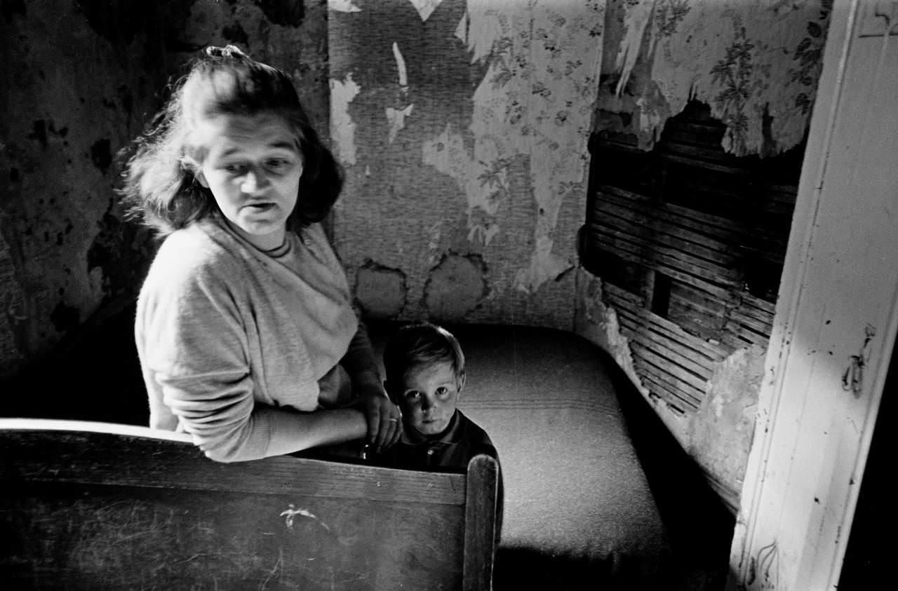 Mother and son in slum housing Manchester 1971