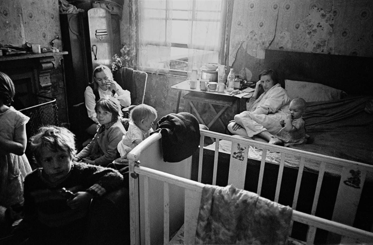 Family living in a single room Moss Side, 1969