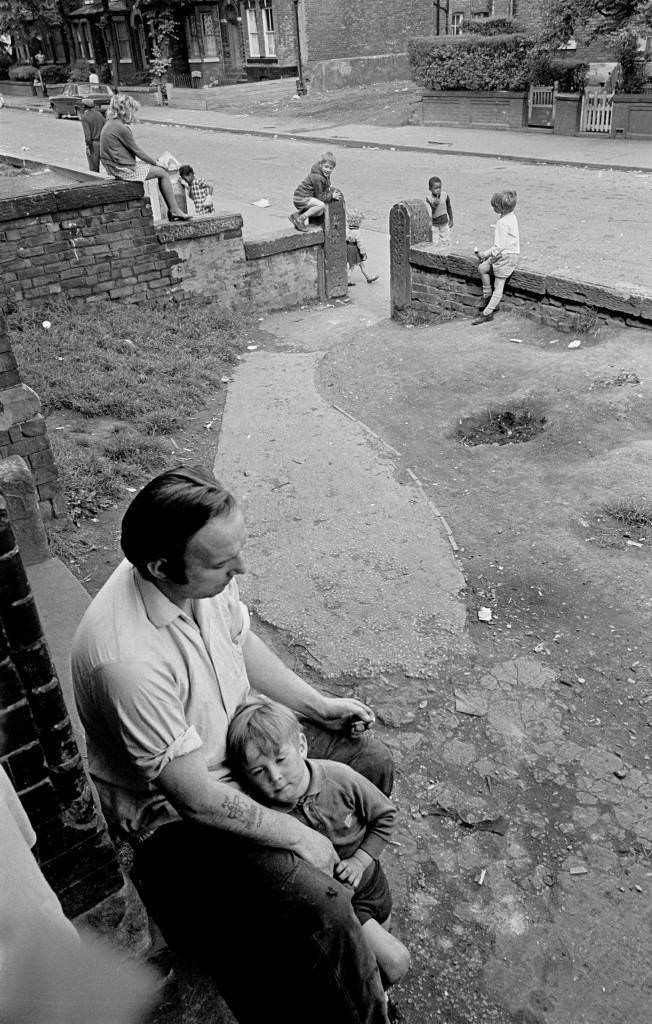 Father and son on front porch of Manchester multilet 1972