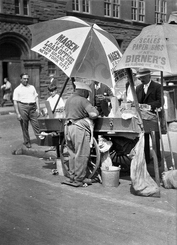An oyster vendor on the Lower East Side near Grand Street, New York City, 1930.