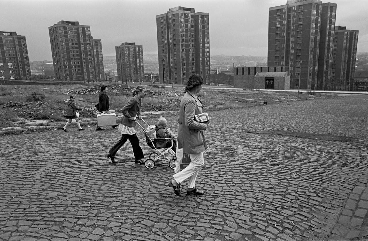 Families wlking across slum clearance site Newcastle upon Tyne 1972
