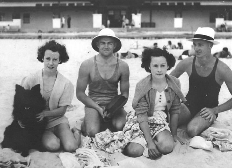 Group of young people enjoying a day at the beach with their dog, Queensland