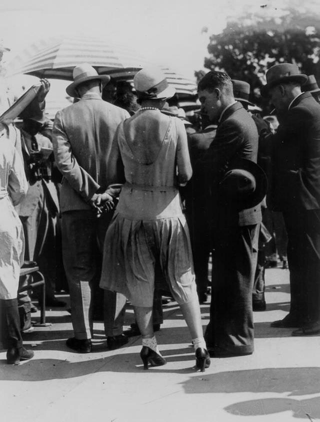 Young lady in a low backed dress and cloche hat at the races Brisbane, Queensland