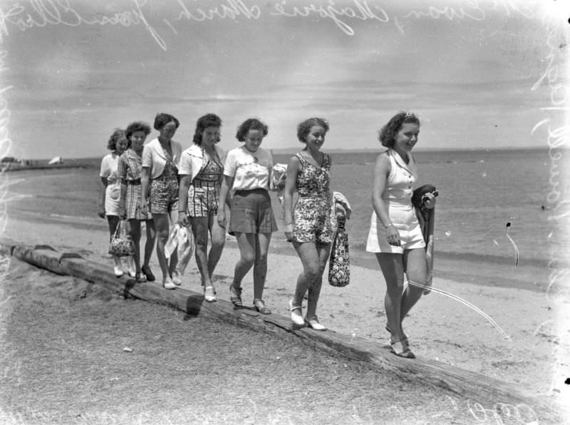 Young women taking a walk along the beach, Queensland
