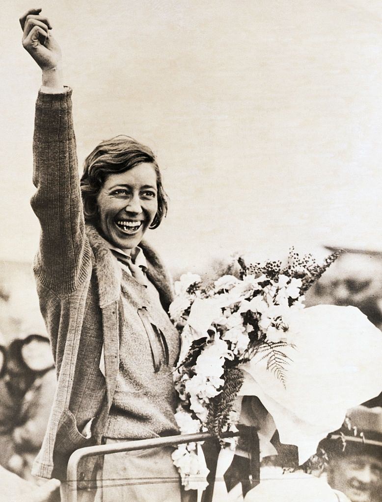 Australia- Miss Amy Johnson, the 19-year-old British aviatrix, is beside herself with joy after landing in Brisbane, 1930