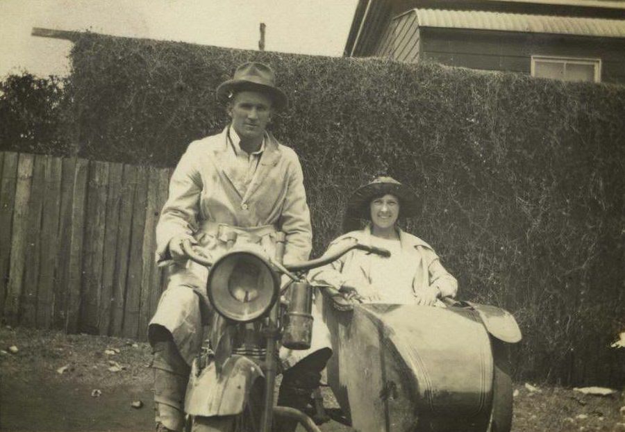 Motorbike and sidecar with rider and passenger, ca. 1922.