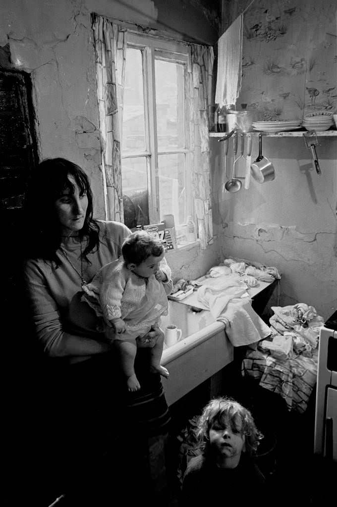 Mother and children dealing with the washing Salford 1971