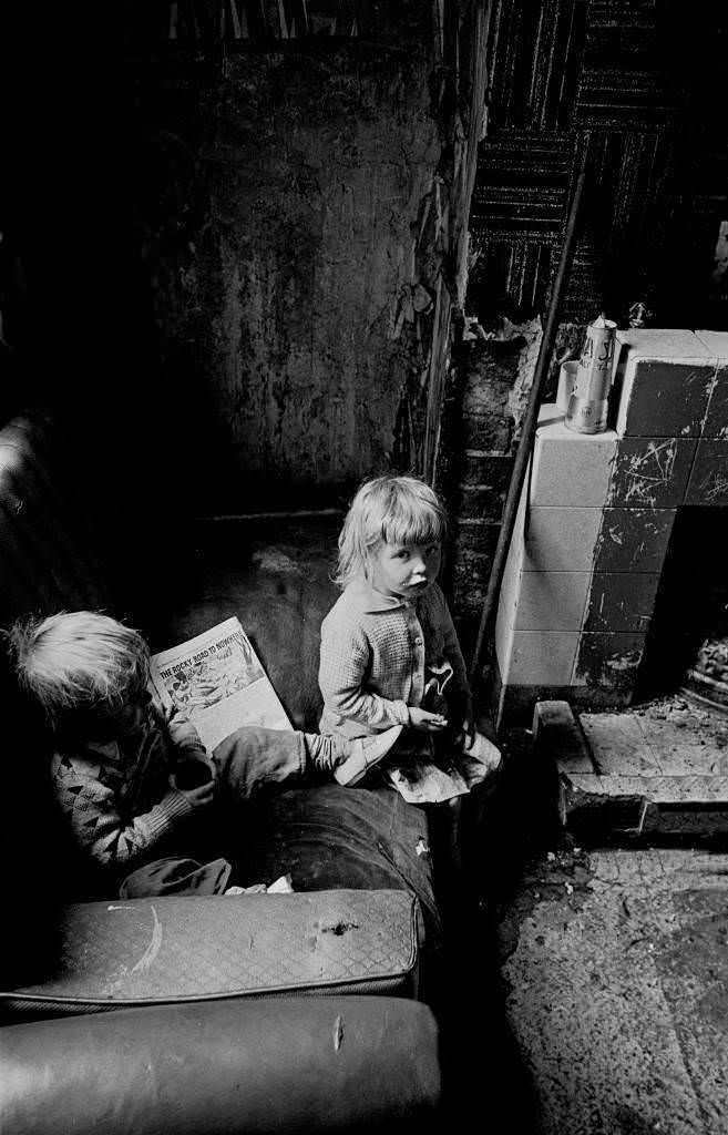 Children with comic in a Salford slum property 1971