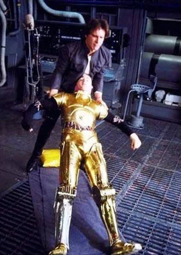 The suit used for C-3PO was notoriously clunky, which made movement and communication incredibly difficult for actor Anthony Daniels. Here, Harrison Ford helps up his immobile colleague.