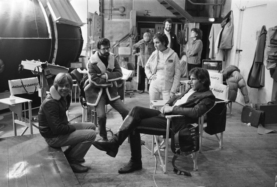 George Lucas has a quick pow wow with his stars between takes on The Empire Strikes Back.