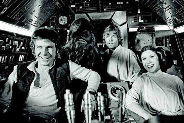The main cast of Star Wars: Episode IV A New Hope pose for a photo in the Millennium Falcon.