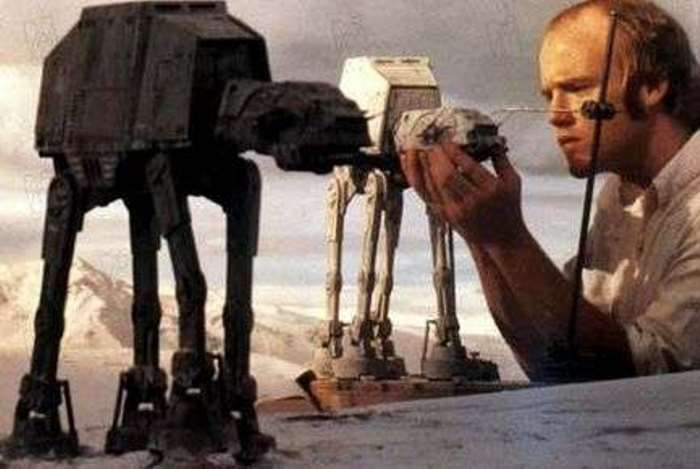 A set manager meticulously plans a scene with AT-ATs for Return Of The Jedi.