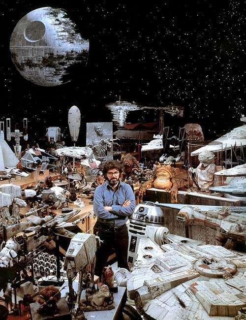 George Lucas stands among the many miniature creations of the Star Wars universe.