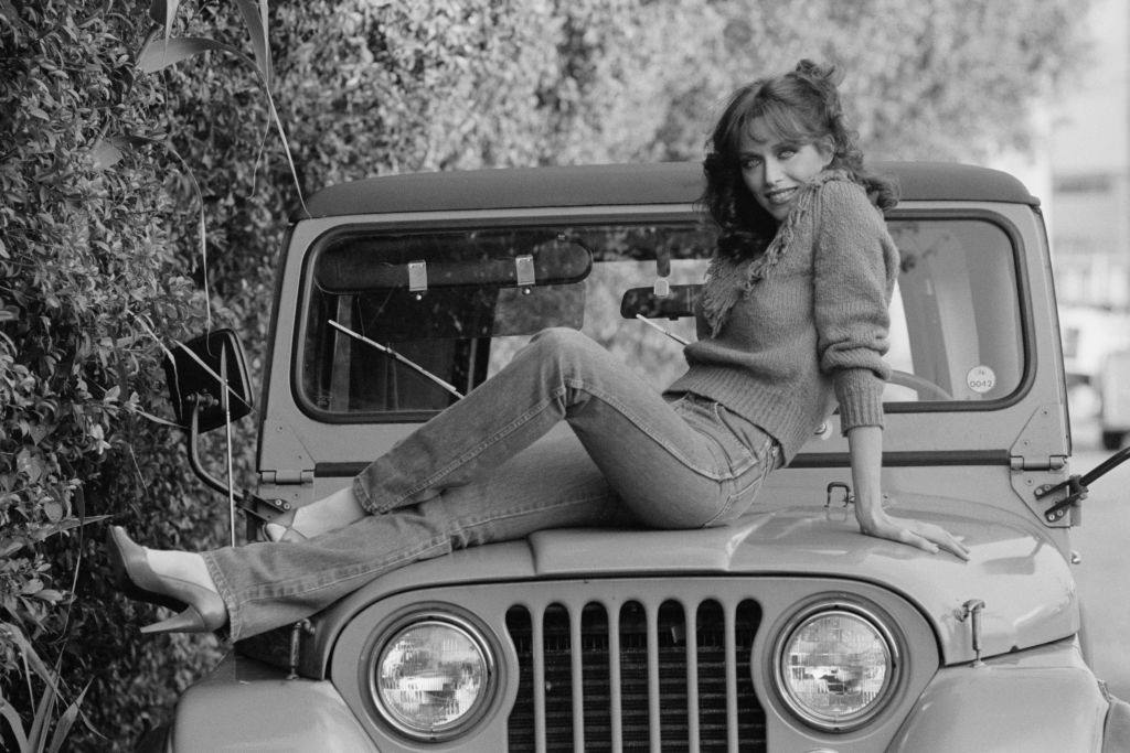 Tanya Roberts posing on the car, 1981.