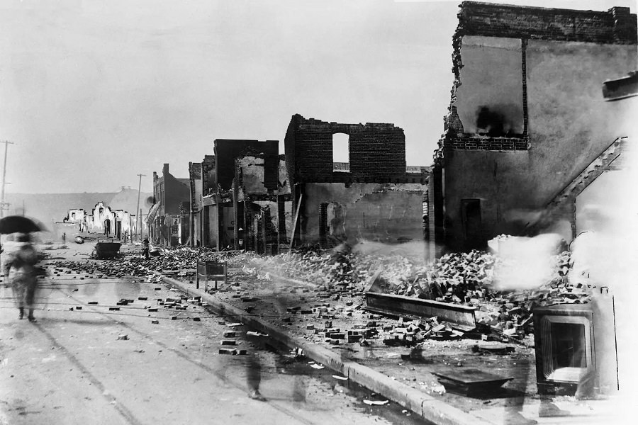 This photo shows the aftermath of the massacre at the east corner of Greenwood Avenue and East Archer Street in June 1921.