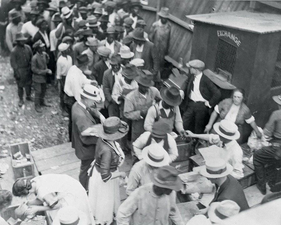 Black residents of Tulsa line up to receive meals from good Samaritans on June 1, 1921.