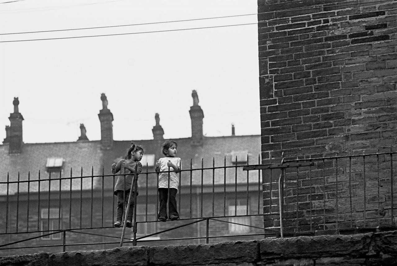 Girls on a fence, Bradford, 1972