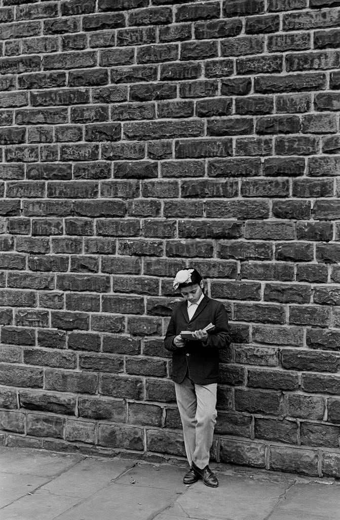 Sikh boy reading a comic, Bradford, 1969