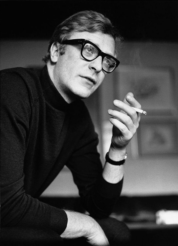 Michael Caine smoking a cigarette, 1965.