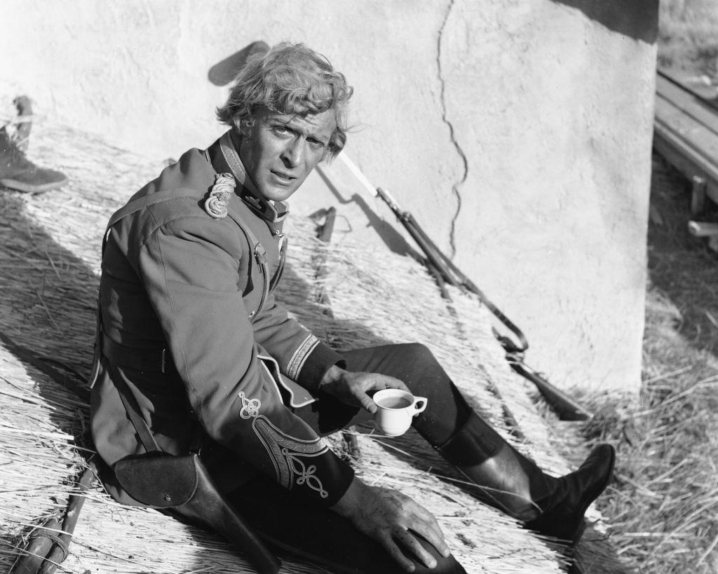 Michael Caine takes a tea break on the set of 'Zulu', 1964.