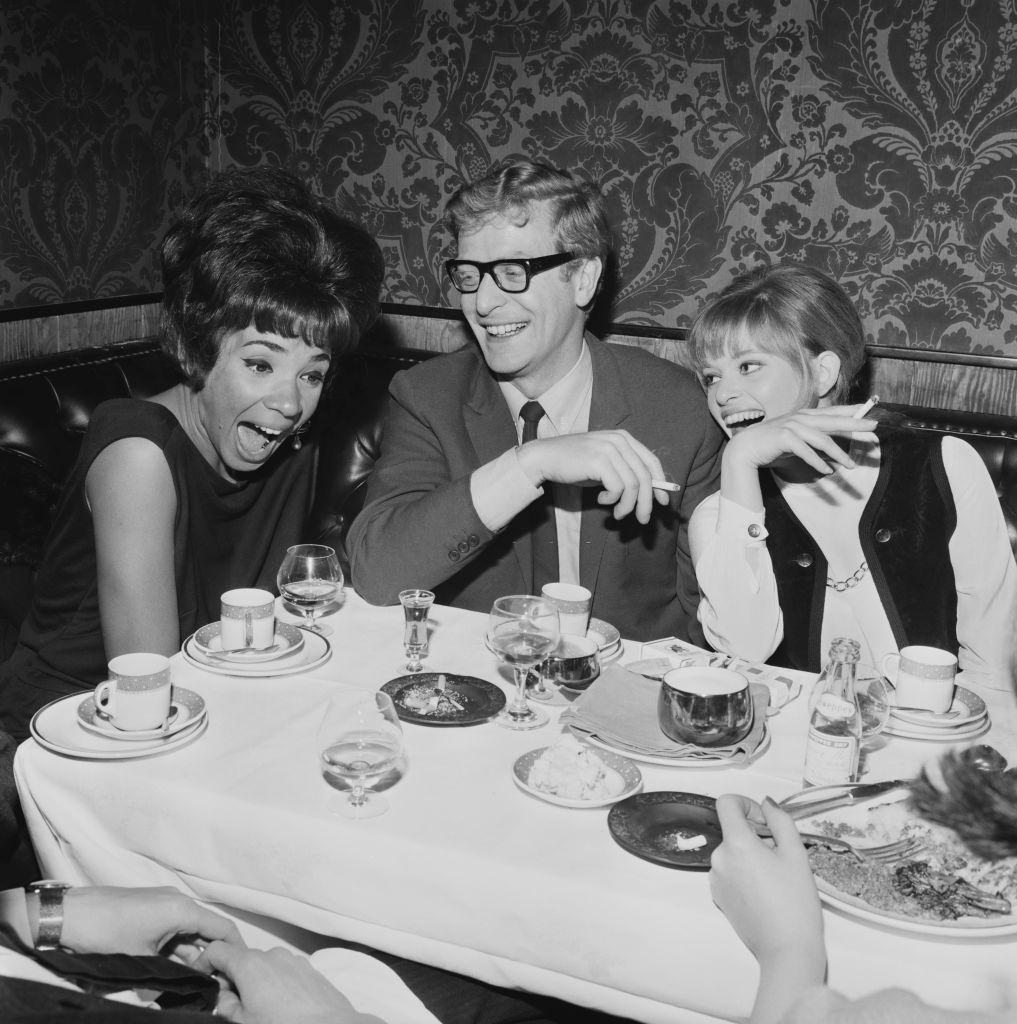 Michael Caine with Welsh singer Shirley Bassey and fashion designer Edina Ronay, 1964.
