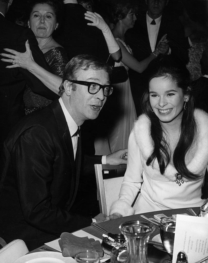 Michael Caine talks with Geraldine Chaplin, Charlie Chaplin's daughter, 1965.