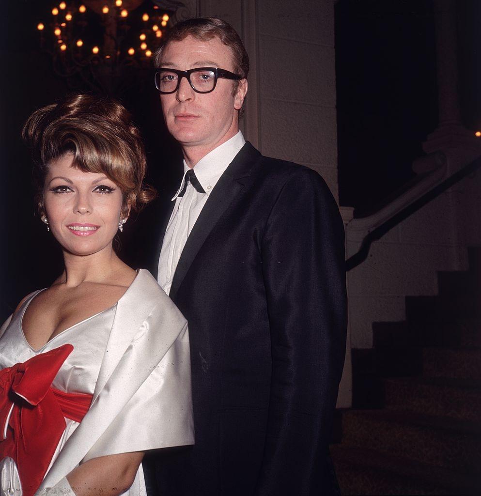 Michael Caine with American pop singer Nancy Sinatra at the premiere party for Martin Ritt's film, 'The Spy Who Came in from the Cold', 1965.